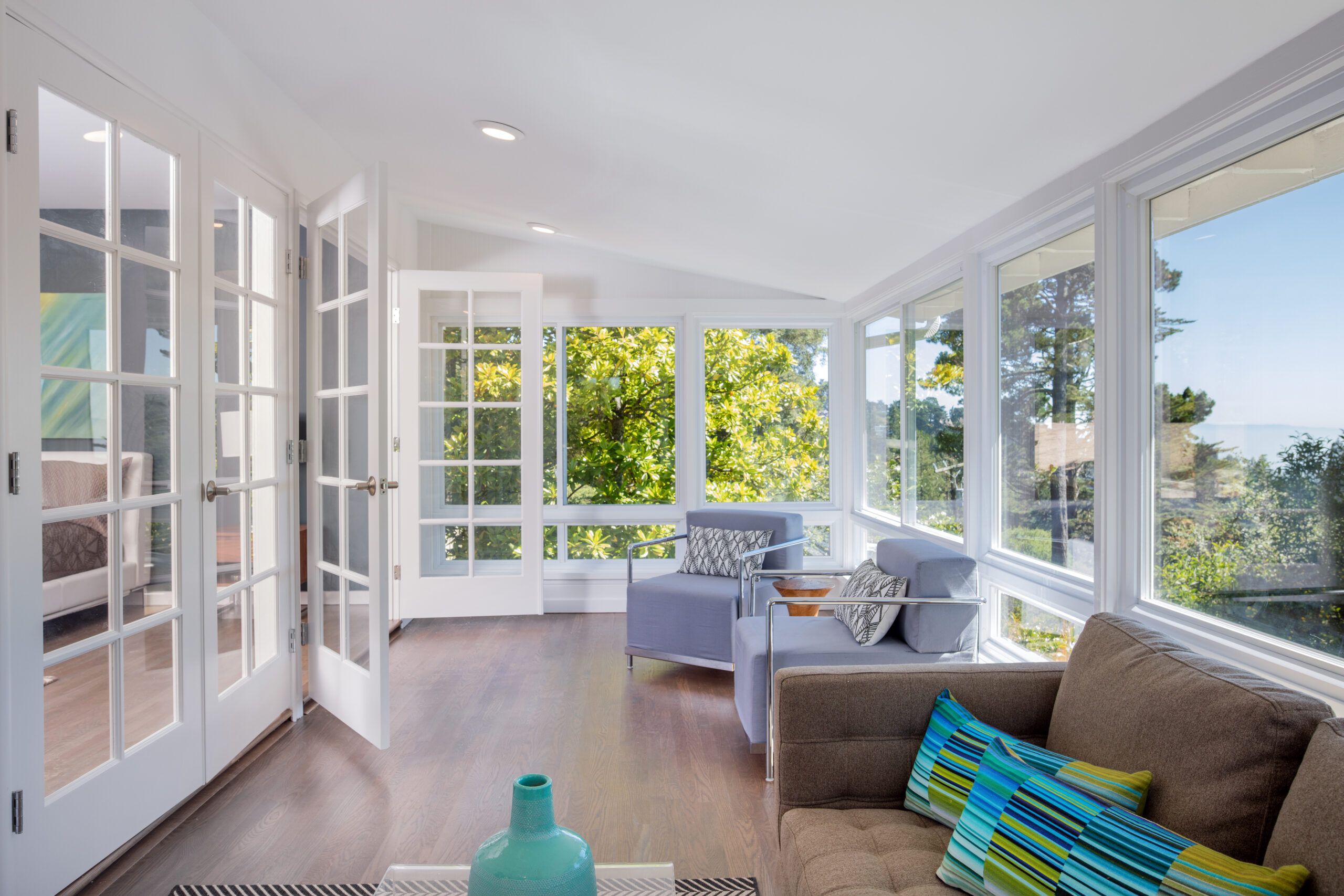 Bright solarium-style sunroom off the master suite.