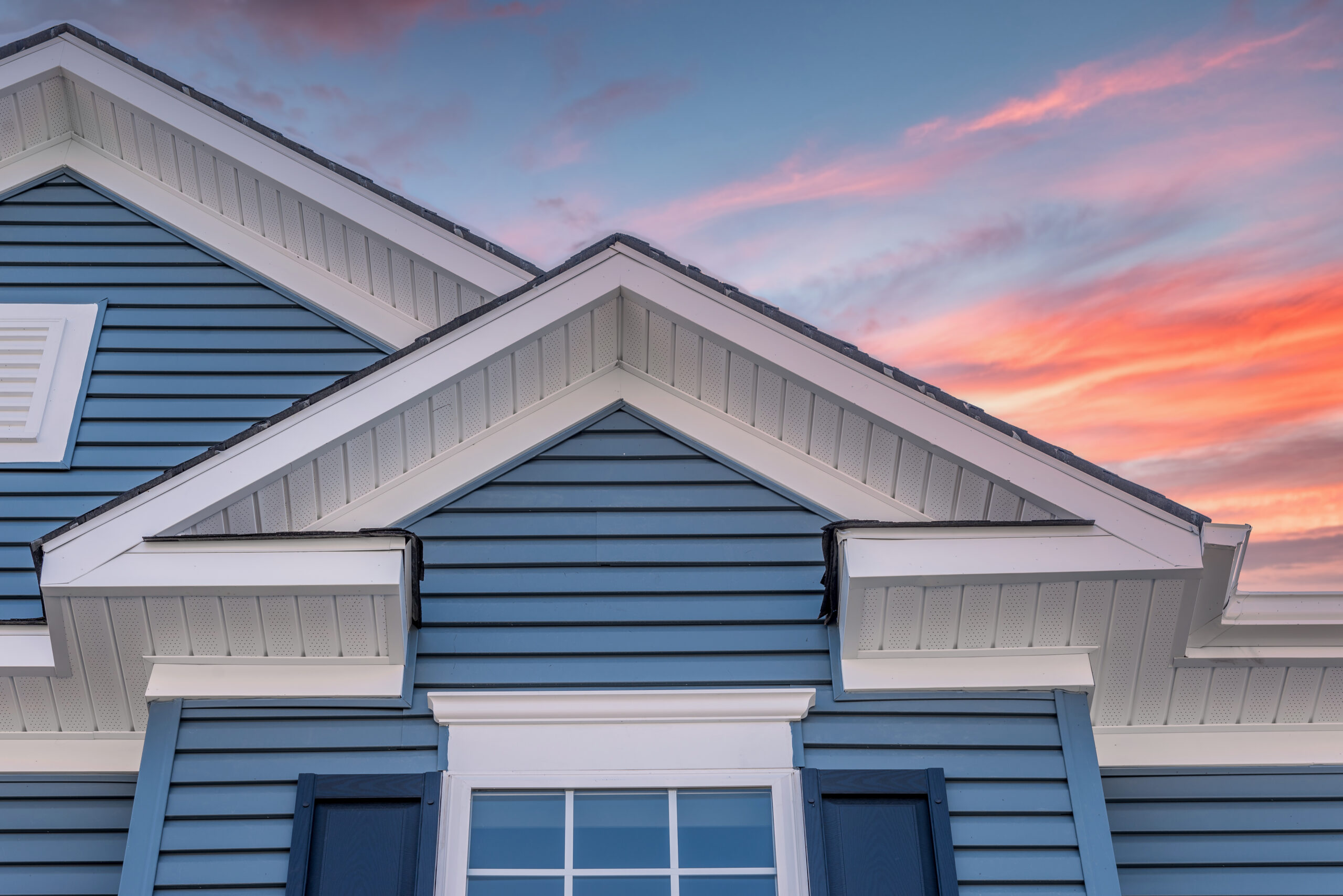 Triangle shape decorative gable with colonial white soffit and f